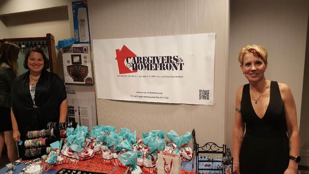 Shawn Moore and Rachel Moyers welcoming caregivers at the Wounded Warrior Project Christmas Gala 